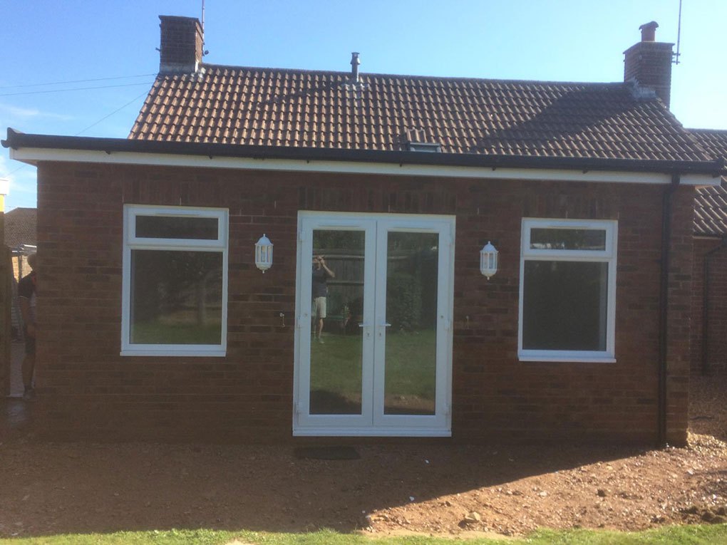 Single storey brick elevation with new french doors and windows, finished brickwork