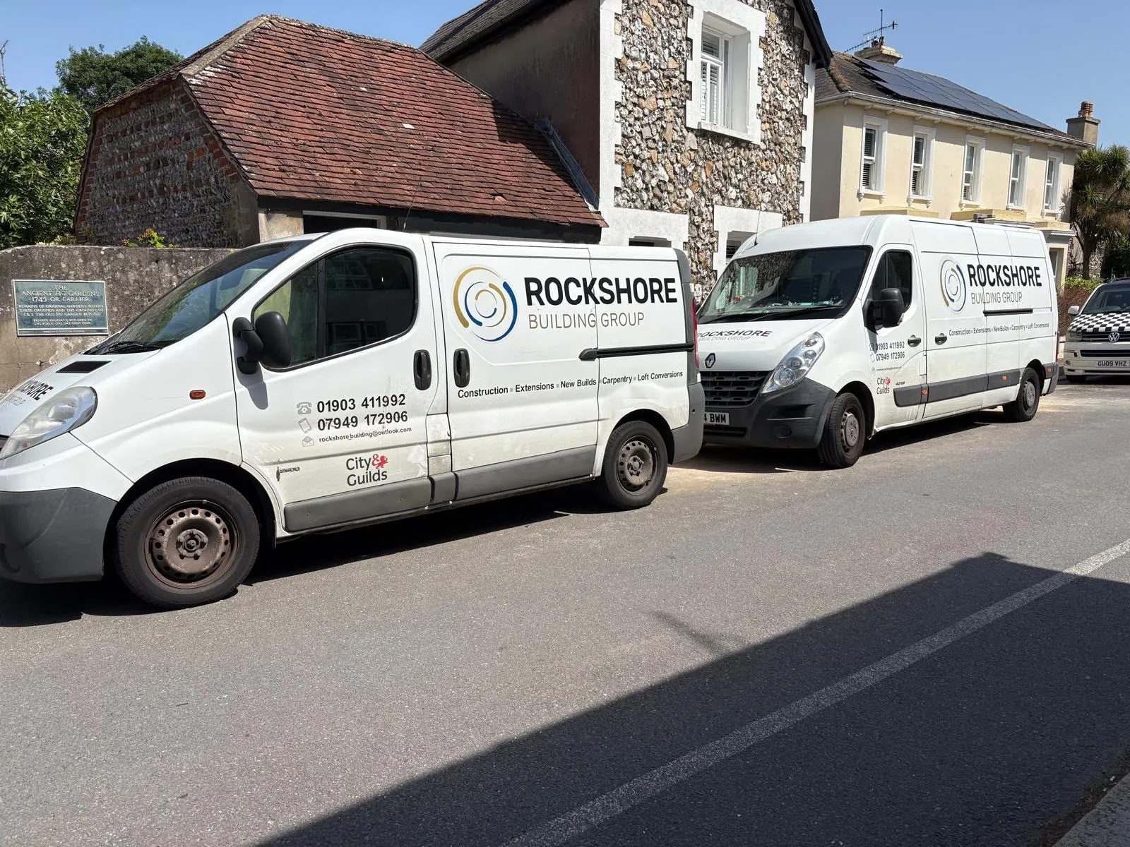 Rockshore Building Group vans parked on a West Sussex village street